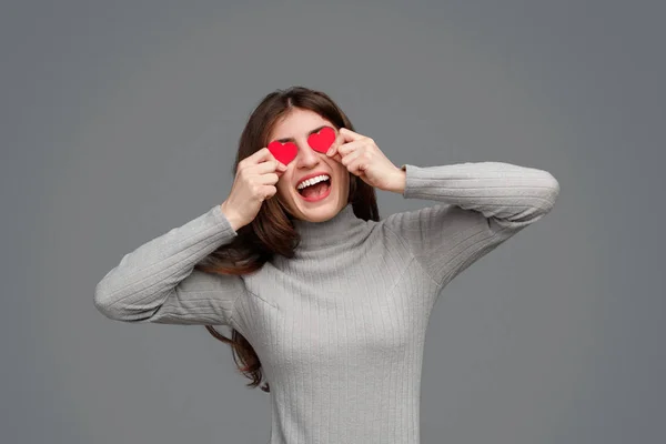 Excited lady with tiny hearts near eyes — 图库照片