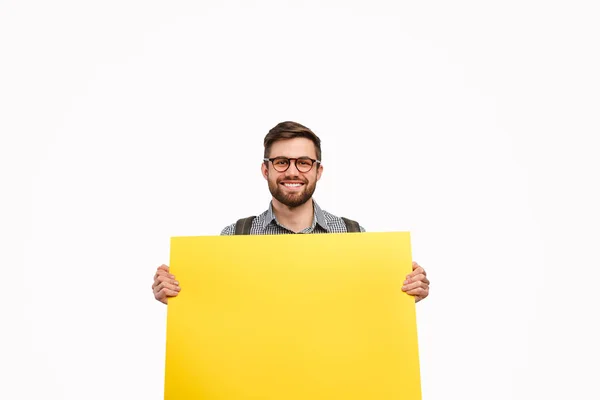 Studente maschio con poster giallo — Foto Stock