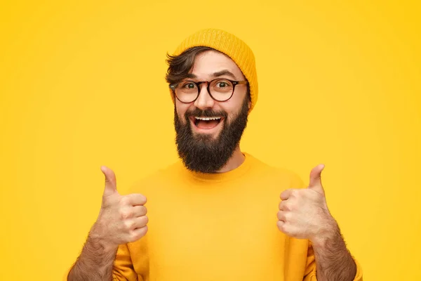 Bearded male gesturing thumb ups — Stock Photo, Image