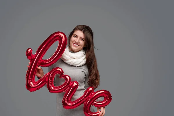 Smiling female with love writing — Stock Fotó