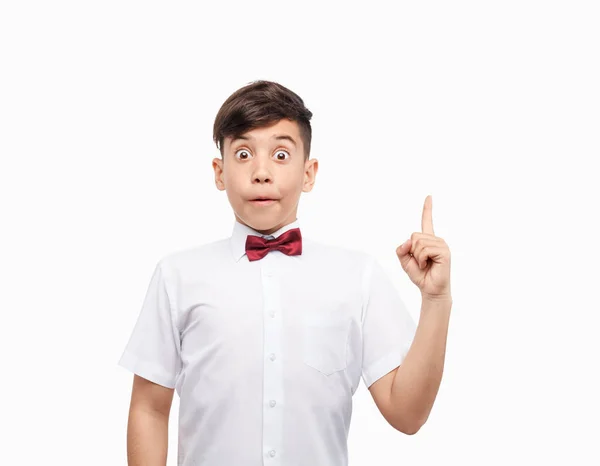Funny schoolboy pointing up — Stock Photo, Image
