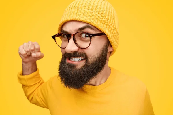 Angry hipster punching camera — Stock Photo, Image