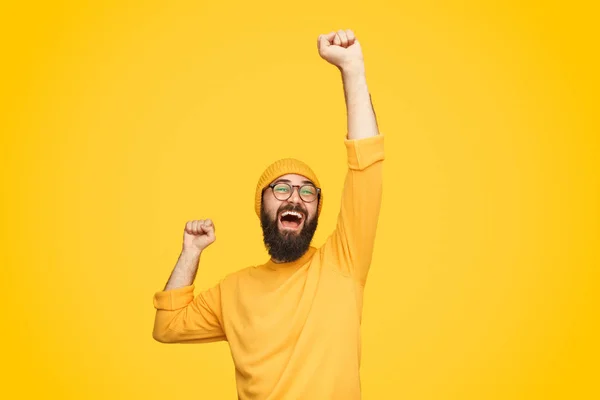 Excited bright man with fist up — Stock Photo, Image