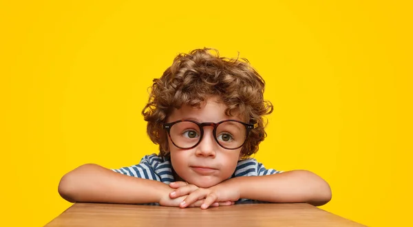 Smart curly boy in glasses — Stock Photo, Image