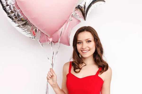 Lächelnde Frau mit Party-Luftballons — Stockfoto