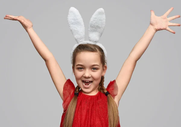 Bright girl in white ears holding hands up — Stock Photo, Image