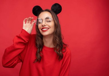 Dreaming girl in mouse ears and glasses  clipart