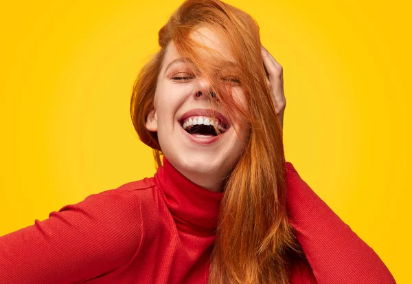 Laughing model touching ginger hair — Stock Photo, Image