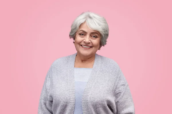 Friendly senior woman looking at camera — Stock Photo, Image