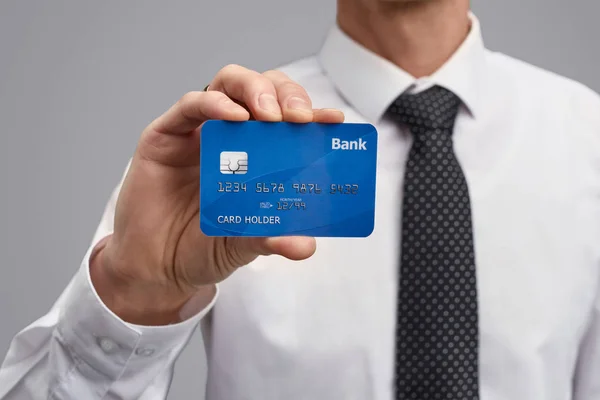 Crop businessman showing credit card — Stock Photo, Image