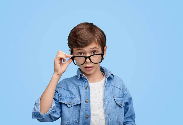 Adorable boy looking at camera with question — Stock Photo, Image