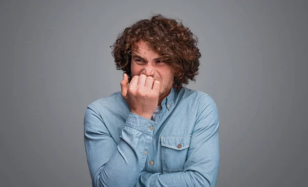 Stressed man biting nails — Stock Photo, Image