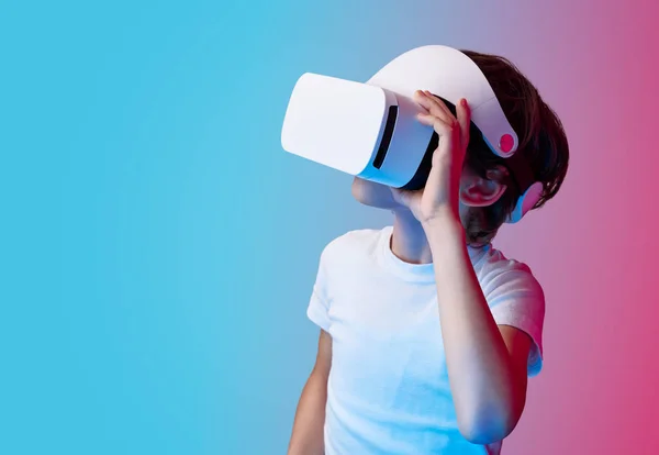 Boy in VR glasses on colorful background — Stock Photo, Image