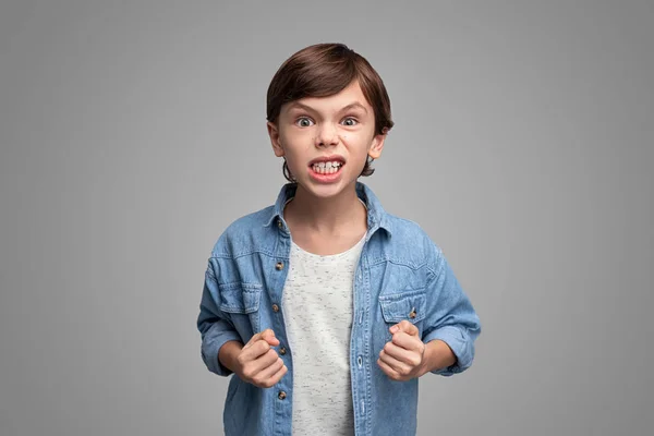 Aggressive boy looking at camera — Stock Photo, Image