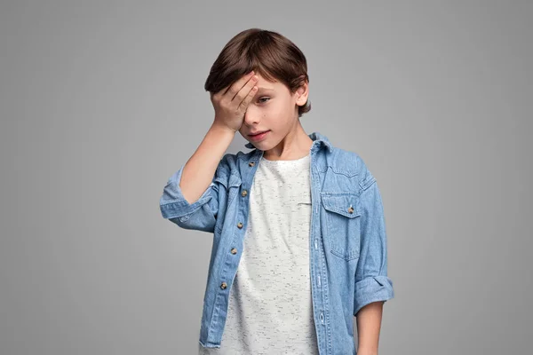 Sick boy touching forehead — Stock Photo, Image