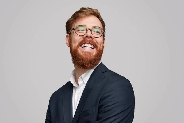 Cheerful red bearded businessman looking away — Stock Photo, Image