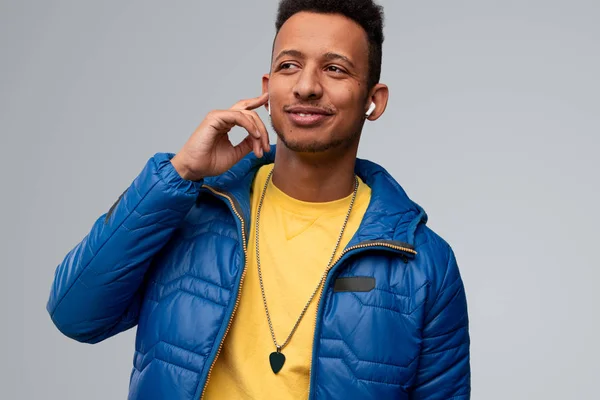 Glad black guy listening to music — Stock Photo, Image