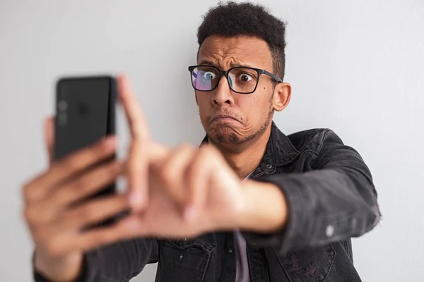 Crazy black guy taking selfie — Stock Photo, Image