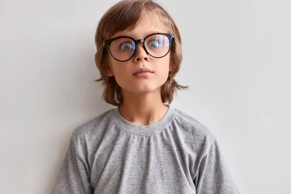 Shocked schoolboy looking at camera — Stock Photo, Image