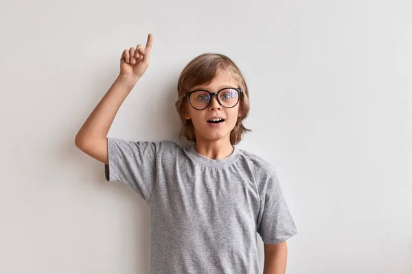 Smart schoolboy having idea — Stock Photo, Image