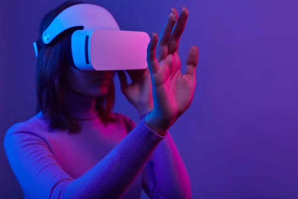 Futuristic female touching virtual screen