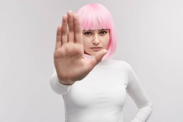 Futuristic woman showing stop gesture — Stock Photo, Image