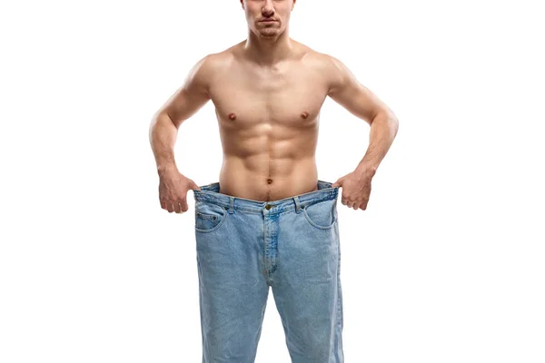 Crop guy em jeans grandes — Fotografia de Stock