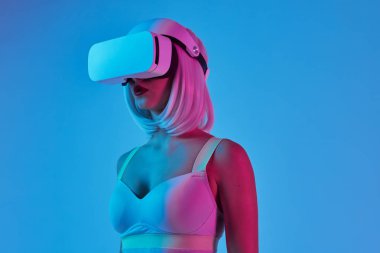 Woman in bra playing VR games