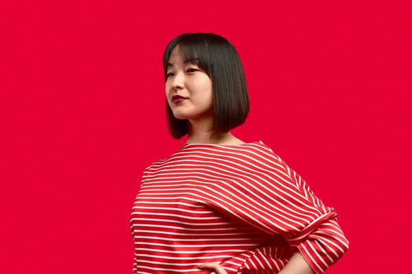 Confident Asian woman in striped clothes — Stock Photo, Image