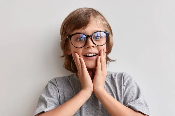 Amazed schoolboy in spectacles — Stock Photo, Image