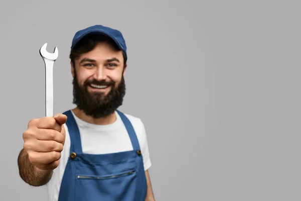 Cheerful repairman with wrench — Stock Photo, Image