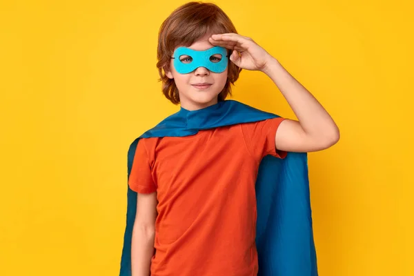 Little superhero saluting for camera — Stock Photo, Image