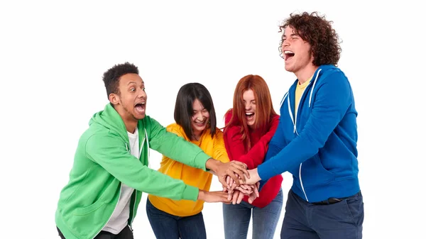 Excited multiracial team uniting hands — Stock Photo, Image