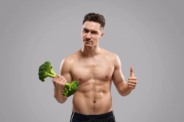Strong man approving healthy lifestyle — Stock Photo, Image