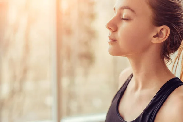 Young woman doing breathing exercise — Stock Photo, Image