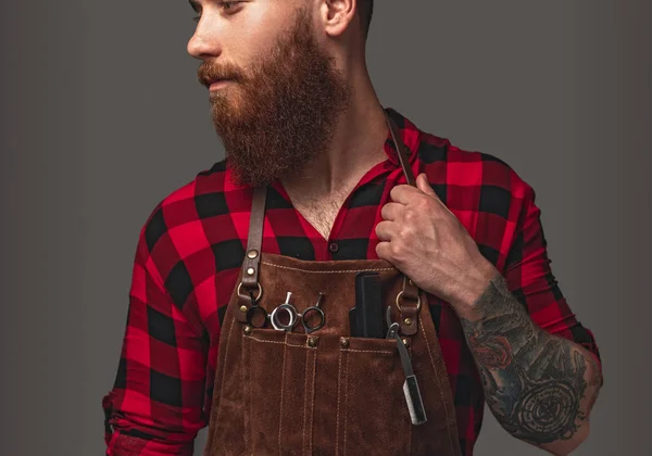 Confident stylist adjusting apron — Stock Photo, Image