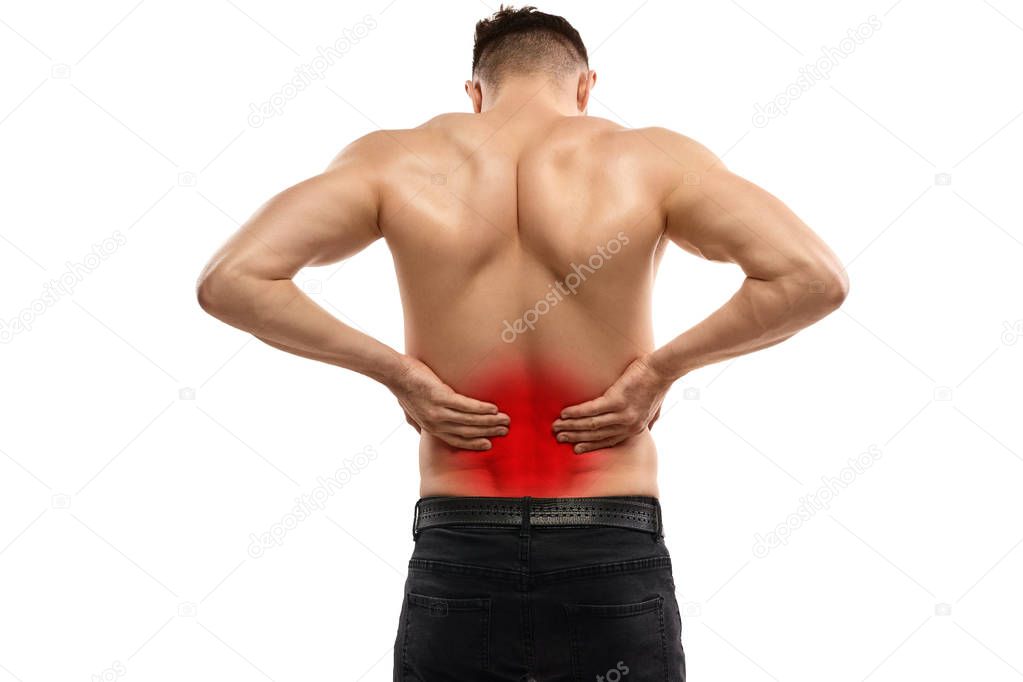 Muscular athlete suffering from backache