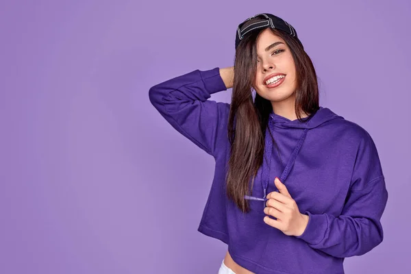 Modern female in hoodie and cap