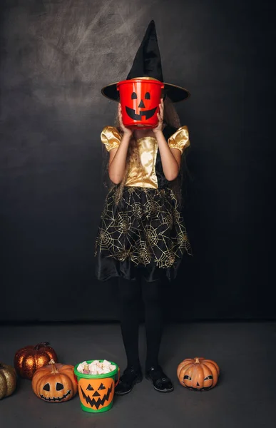 Girl with candy bucket used as mask — Stock Photo, Image