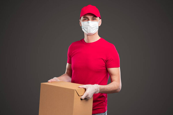 Delivery man in protective mask and gloves