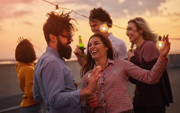 Excited friends dancing during party — Stock Photo, Image