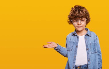 Boy pointing at empty space clipart