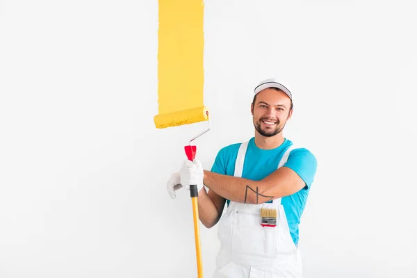 Happy male painter with roller — Stock Photo, Image