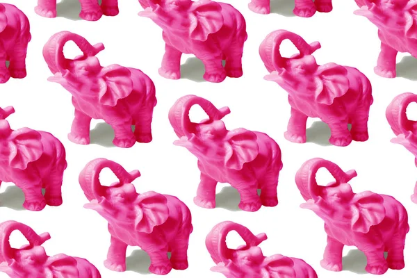 pattern of isolated pink elephants on an even color background