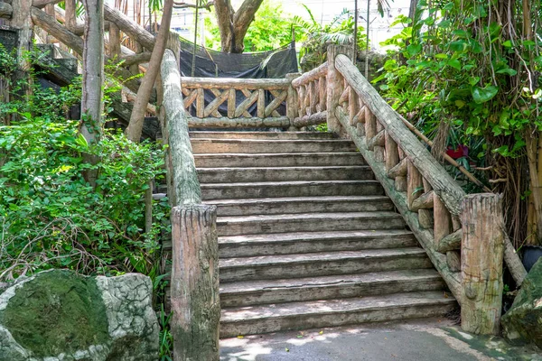 Concrete brick stairway leading up a walkway through the jungle with trees, Dam concrete ladder, Old concrete