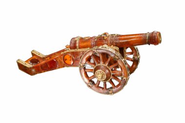 A handcrafted model of a vintage cannon, featuring wooden wheels and intricate details, is showcased against a plain background, highlighting its antique charm and craftsmanship.