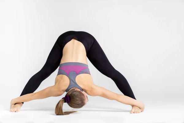 Full Length Portrait Young Sportwoman Stretching Muscles While Sitting Floor Stock Photo