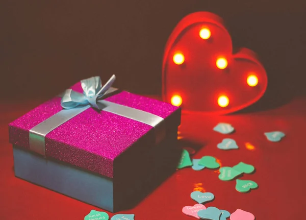 Bright Pink Gift Bow Red Background Decorations Multi Colored Hearts — Stok Foto