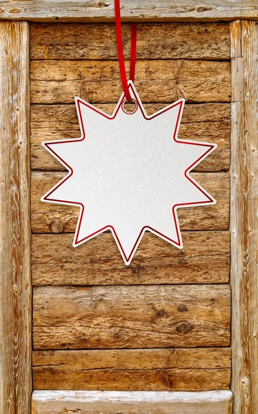 Star price sticker over wooden frame background with copy space.