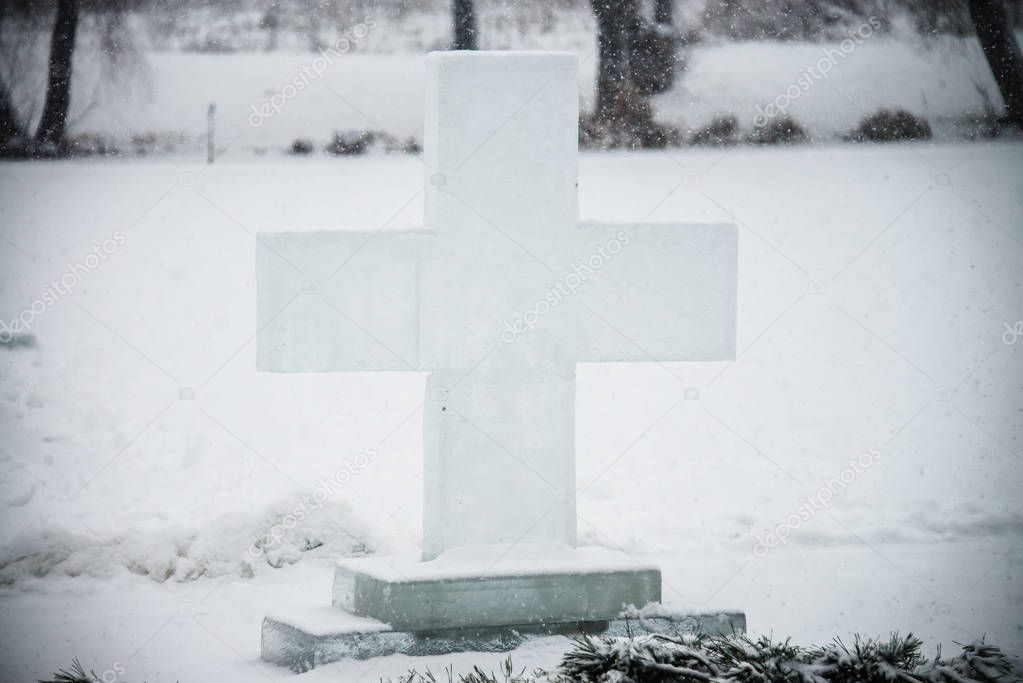 The cross is drilled out of ice. A cross was placed above the hole for bathing. Before the bathing ceremony. Religious holiday of Epiphany. Ukraine. Bilogorodka January 18, 2018